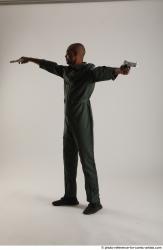 ERIC PILOT STANDING POSE WITH GUNS